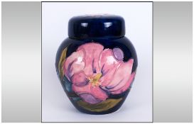 Moorcroft Lidded Preserve Pot ' Magnolia - Pink ' Design on Blue Ground. Label to Base Reads -