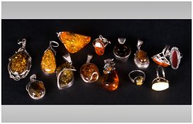 Collection of Assorted Amber Coloured  Pendants (9) together with Five Rings