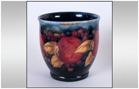 William Moorcroft Small Squat Vase, 'Pomegranate and Berries' pattern, circa 1920's; 3.5 inches