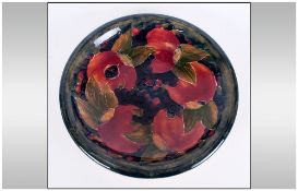 William Moorcroft Signed and Early Shallow Bowl ' Pomegranate, Leaves and Berries ' Design. c.1920'