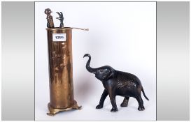 Bronze Elephant Figure, 7'' in length, 7'' in height together with a brass companion set.