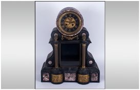 Large Black Slate French 19th Century Mantle Clock with an exposed glass front with Brass column