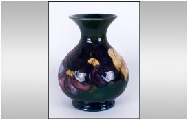 Moorcroft Globual Shaped Vase ' Clematis ' Design on Green Ground. Label to Base Reads Potters To