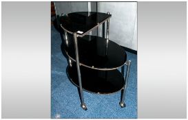 A Rare Shaped 1930's Deco Tea Trolley with castor feet. With Two tiered shelves, the top shelf being