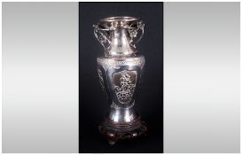 Chinese Silver Two Handle Vase, raised on a carved wooden stand. Circa 1905-10, 95 grams. Silver.