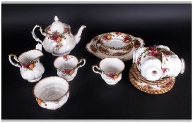 Royal Albert Country Rose Tea Set, 6 cups & saucers, 1 tea pot, sugar & cream, 6 side plates, 1 cake