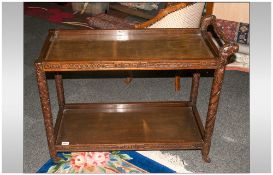 Oriental Carved Tea Tea Trolley the push handle in the form of dragons heads, two tier.