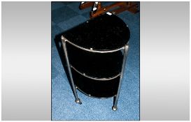 A Rare Shaped 1930's Deco Tea Trolley with castor feet. With Two tiered shelves, the top shelf being