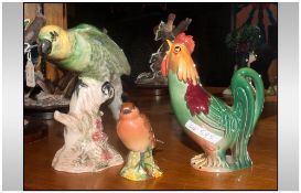 Beswick Cockerel Figure Number 1001.74. 5'' together with a Beswick Parrot sitting on a branch,