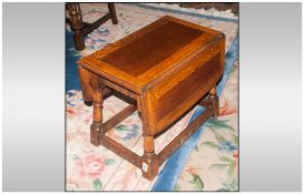 A 1960's Small Oak Flap Sided Coffee Type Table,