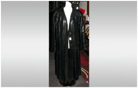 Three Quarter Length Ladies Black Leather Coat with suede stripes. fully lined. Button fastenings.