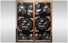 Pair Of Chinese Silk Embroidered Panels, depicting butterflies amongst flowers on a black