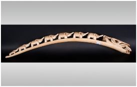 Antique Carved Ivory Tusk, fully carved with elephants, Tail To Tail. 23'' in length.