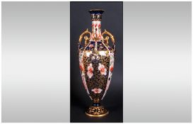 Royal Crown Derby Two Handled Urn Vase date 1918. Stands 9.75 inches high. Overpainting to spout