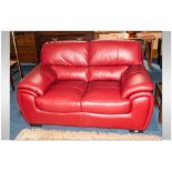 Modern Two Seater Red Leatherette Sofa, 62'' in width, 36'' in depth.