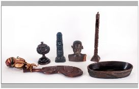 Six Ethnic Wood Carvings Consisting Of An Oval Bowl, carved native head, two totems, club, lidded