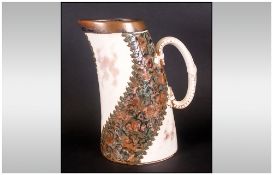 Staffordshire Leaning Jug with swirling agate slipware bands to the body. Lozenge seal/mark to