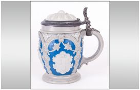 Mettlach Stein In A Blue Glaze with applied cameos depicting heraldic sheilds and tracery pewter