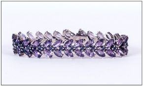 A Ladies Silver Bracelet Set With Amethysts. 7.75 Inches In Length.