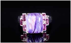 Russian Charoite and Rhodolite Garnet Ring, a cabochon of 5.25cts of the rare mottled purple