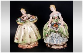 1930's Italian Pottery Figures Of Flower Sellers, wearing green decorated dresses carrying baskets