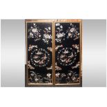 Pair Of Chinese Silk Embroidered Panels, depicting butterflies amongst flowers on a black