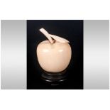 Japanese carved Ivory apple with wooden base. Early 20th century.