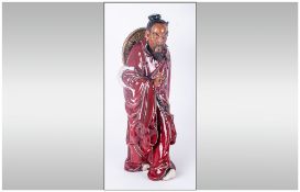 Large Oriental Red Robed Figure, the man with his hair in a top-knot covered with a dark blue cloth,