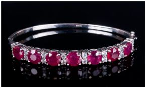 Ruby Tennis Bracelet, 18cts of rubies with a deep fuchsia pink undertone, oval cut and set in silver