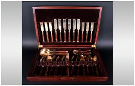 A Vintage Bronze & Wood 48 Piece Canteen Of Cutlery Marked 'Made In Thailand' Boxed.