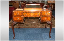 Edwardian Walnut Queen Anne Style Ladies Writing Desk of serpentine form with leather top. Central