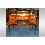 Edwardian Walnut Queen Anne Style Ladies Writing Desk of serpentine form with leather top. Central