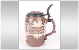 Mettlach Stein In A Brown Glaze With cameo to front of a loving couple with German Verses To The