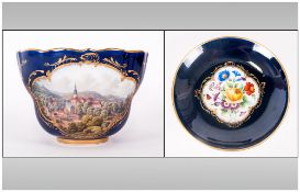 Meissen Large Cabinet Cup and Saucer, the cup showing a hand painted, polychrome scene of