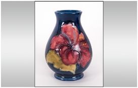 Moorcroft Small Vase Early Version Of The Hibiscus Design On Blue Ground, Stands 3.75'' in height,