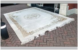 Large Chinese Ivory Coloured Carpet with a picked out embossed floral border in beige colour.