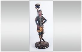 Late 19thC French Hand Painted Spelter Candlestick Holder in the form of a woman wearing mostly