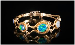 18ct Gold & Black Opal Set Bracelet the opals of good quality. Marked 18ct. 13.6 grams.