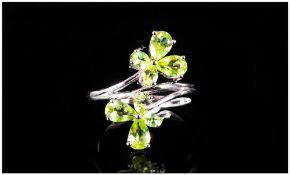 Peridot Butterfly Crossover Ring, each end of the crossover shank of rhodium vermeil and silver