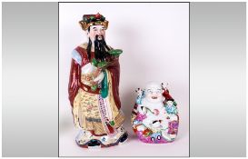 Two Chinese Famile Rose FIgures one of a standing wise man holding a Ruya, 15'' in height, The other