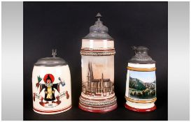 Three Antique German Steins With Pewter Lids one depicting a drinking monk, one depicting Heidleberg