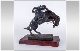 Frederic Remington Franklin Mint Bronze Sculpture Titled 'The Brono Buster' Circa 1988. Raised On