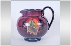 W.Moorcroft Signed Flambe Leaves & Berries Pattern Jug 'Rouge' Colourway. 4.5" in height.