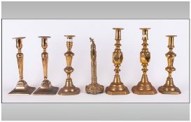 Three Pairs Of Victorian Brass Candlesticks various heights & designs. Tallest measuring 10".