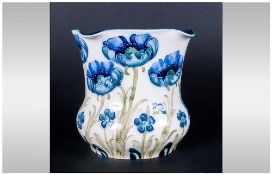 William Moorcroft Signed Florianware Vase 'Blue Poppy' Design on white ground. Circa 1902. Stands 4.