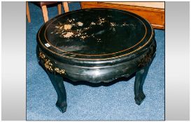 Chinese Black Lacquered Decorated Round Coffee Table on shaped legs, of traditional form.