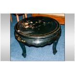 Chinese Black Lacquered Decorated Round Coffee Table on shaped legs, of traditional form.