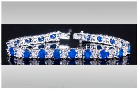 Blue Sapphire and White Topaz Bracelet, eighteen large, rich blue, round cut sapphires,
