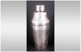 Art Deco Silvered Metal Cocktail Shaker with a planished beaten body, impressed mark to base. NR.