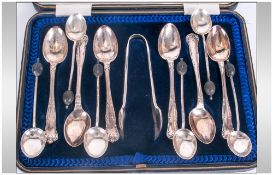 Six Silver Teaspoons And Associated Sugar Tongs, Fitted In Blue Velvet And Silk Lined Case,